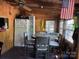 Open dining area with a round table, chairs, and essential appliances at 120 Starboard Trl, Mount Gilead, NC 27306