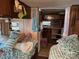 Interior space showcasing two twin beds, compact kitchen, and ample storage at 120 Starboard Trl, Mount Gilead, NC 27306