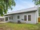 Back exterior view of home with patio, windows, and siding at 12013 Dolomite Dr, Pineville, NC 28134