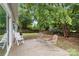 This backyard patio features outdoor seating and a lush green lawn at 12013 Dolomite Dr, Pineville, NC 28134
