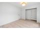 Bright bedroom features hardwood floors, closet, and modern ceiling light at 12013 Dolomite Dr, Pineville, NC 28134