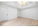Bright bedroom with recessed lighting, light wood floors, and two closets at 12013 Dolomite Dr, Pineville, NC 28134