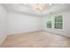 Light-filled bedroom with recessed lighting, light wood floors, and bright white walls at 12013 Dolomite Dr, Pineville, NC 28134