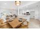Modern kitchen with stainless steel appliances, white cabinets and countertops, and light wood floors at 12013 Dolomite Dr, Pineville, NC 28134