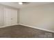 Bedroom features carpet, neutral walls, trim and a ceiling fan with light at 12150 Plover Dr, Charlotte, NC 28269