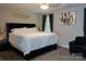 Comfortable bedroom with a king-sized bed and stylish decor at 12150 Plover Dr, Charlotte, NC 28269