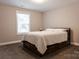 Neutral bedroom with a full-size bed, carpet, and lots of natural light at 12150 Plover Dr, Charlotte, NC 28269