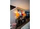 Inviting entryway with a console table and decorative lamps, leading to a modern kitchen area at 12150 Plover Dr, Charlotte, NC 28269