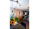 Bright living space features stylish decor, wooden floors, a console table, and house plants at 12150 Plover Dr, Charlotte, NC 28269