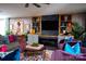 Tastefully furnished living room with custom shelving and decor, plush seating, and a relaxed ambiance at 12150 Plover Dr, Charlotte, NC 28269