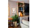 Decorated built-in shelves are showcased in this stylish living room at 12150 Plover Dr, Charlotte, NC 28269