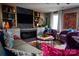 Cozy living room boasts custom shelving, fireplace, and designer touches at 12150 Plover Dr, Charlotte, NC 28269