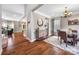 Elegant dining room featuring hardwood floors, chandelier lighting, and large windows for natural light at 12312 Mcallister Park Dr, Charlotte, NC 28277