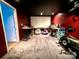 The basement is being used as a theater room, rec room, and gym, all rolled into one space at 125 Shenandoah Loop, Troutman, NC 28166