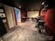 Finished basement area with gray carpet, red walls, and projector screen for entertainment at 125 Shenandoah Loop, Troutman, NC 28166