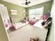 The green bedroom has a house bed frame, closet, and window offering natural light and an excellent view at 125 Shenandoah Loop, Troutman, NC 28166