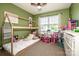 A bedroom with green walls, a house frame bed, and a window for natural light at 125 Shenandoah Loop, Troutman, NC 28166
