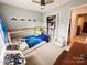 The blue bedroom has a monster truck theme and a comfortable under the house frame bed at 125 Shenandoah Loop, Troutman, NC 28166
