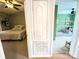 View of two bedrooms showcasing connecting access; one features a vaulted ceiling and the other a wooden canopy bed at 125 Shenandoah Loop, Troutman, NC 28166