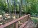 View from the wooden deck showcasing the treeline at 125 Shenandoah Loop, Troutman, NC 28166