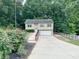Charming two-story home with a spacious driveway and well-maintained landscaping at 125 Shenandoah Loop, Troutman, NC 28166