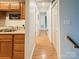 Hallway between kitchen and rooms showing laminate flooring and plenty of storage at 125 Shenandoah Loop, Troutman, NC 28166