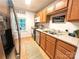 Modern kitchen with stainless steel appliances, eat-in area and ample counter space at 125 Shenandoah Loop, Troutman, NC 28166