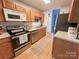 Kitchen with stainless steel appliances, ample counter space, and light wood cabinets at 125 Shenandoah Loop, Troutman, NC 28166