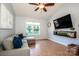 Inviting living room with wood laminate floors, comfortable seating and a flat screen TV at 125 Shenandoah Loop, Troutman, NC 28166