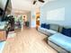 Open-concept living room with wood floors and a view of the dining area and kitchen at 125 Shenandoah Loop, Troutman, NC 28166