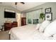 A cozy main bedroom with neutral tones, a window, and wood furnishings at 125 Shenandoah Loop, Troutman, NC 28166