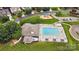 Aerial view showcases the community pool, clubhouse, playground, and landscaping in a desirable neighborhood at 129 N Audubon Ave, Mooresville, NC 28117