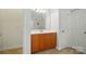 Bathroom featuring wooden vanity with light countertop, a large mirror, and tile flooring at 129 N Audubon Ave, Mooresville, NC 28117
