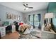 Stylish bedroom with a zebra rug, modern art and a comfortable bed at 129 N Audubon Ave, Mooresville, NC 28117