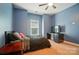 Comfortable bedroom with blue walls, a window, and a cozy atmosphere at 129 N Audubon Ave, Mooresville, NC 28117