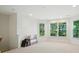 Spacious bonus room with ample natural light from multiple windows and neutral carpet at 129 N Audubon Ave, Mooresville, NC 28117