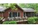 Beautiful brick home featuring an outdoor seating area on a spacious wooden deck at 139 Cricket Creek Dr, Cherryville, NC 28021