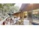 View of the back of the house from the wooden deck, with outdoor seating at 139 Cricket Creek Dr, Cherryville, NC 28021