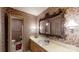 Bathroom with an ornate mirror, floral wallpaper, sink vanity, and walk-in shower at 139 Cricket Creek Dr, Cherryville, NC 28021