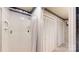Bathroom featuring a walk-in shower, floral wallpaper, and storage closets at 139 Cricket Creek Dr, Cherryville, NC 28021