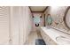 Bright bathroom with lots of storage and a long vanity with oval mirrors at 139 Cricket Creek Dr, Cherryville, NC 28021