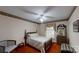 Cozy bedroom with a four-poster bed, dresser, and window, creating a relaxing retreat at 139 Cricket Creek Dr, Cherryville, NC 28021