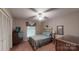 Charming bedroom featuring a double bed, ceiling fan, and classic-style decor at 139 Cricket Creek Dr, Cherryville, NC 28021