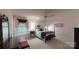 Bedroom with a ceiling fan, accent lamps, and a patterned bedspread, a peaceful escape at 139 Cricket Creek Dr, Cherryville, NC 28021