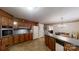 Kitchen view showcasing the cabinets, countertops, oven, and tile flooring at 139 Cricket Creek Dr, Cherryville, NC 28021