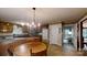 Kitchen with wood cabinets, tile floors, and a bay window, offering ample natural light at 139 Cricket Creek Dr, Cherryville, NC 28021