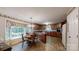 Eat-in kitchen featuring tile floors, wood cabinets, and a bay window with natural light at 139 Cricket Creek Dr, Cherryville, NC 28021