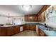 Kitchen boasting wood cabinets, laminate countertops, and a breakfast nook at 139 Cricket Creek Dr, Cherryville, NC 28021