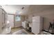 Cozy laundry room features a washing machine, dryer, cabinets and a window for natural light at 139 Cricket Creek Dr, Cherryville, NC 28021