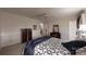 Spacious main bedroom boasts dark wood furniture and a ceiling fan at 139 Cricket Creek Dr, Cherryville, NC 28021